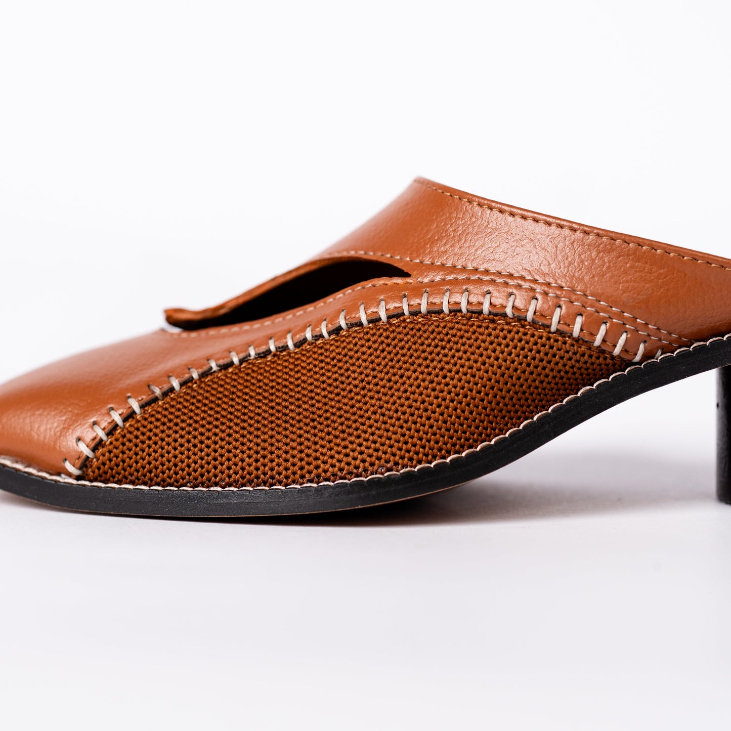 Brown leather shoe on a white background